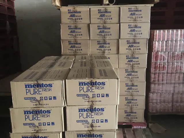 Stacked cartons beside a pallet